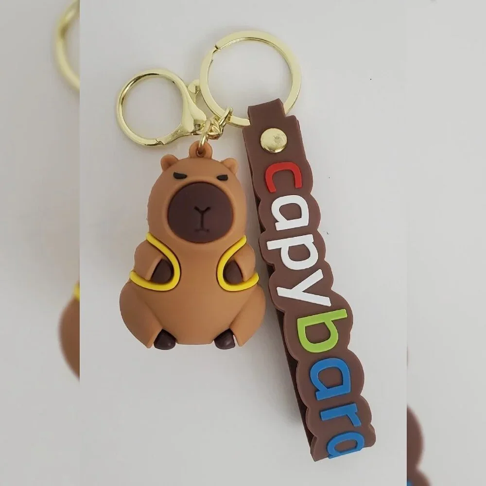 NWT CAPYBARA KEY CHAIN DIFFERENT ACTIONS 3D LOGO